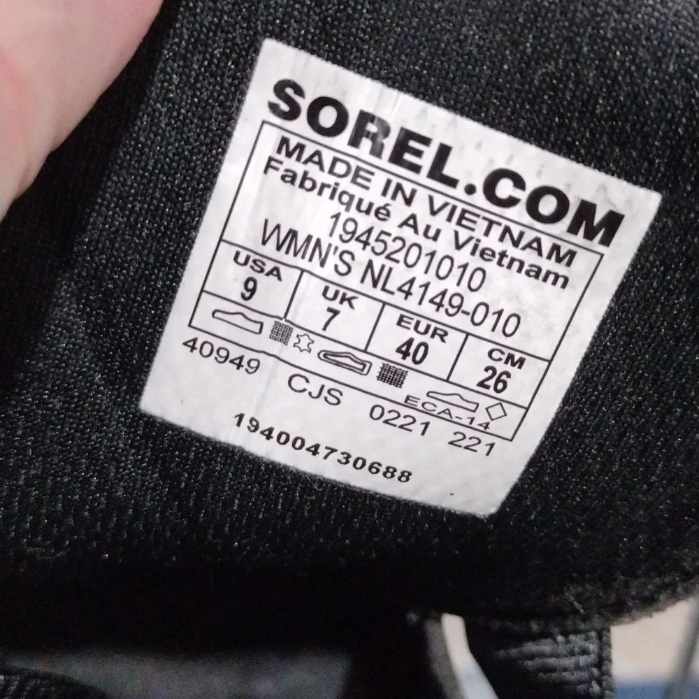 Sorel womens black leather and black mesh sneakers. Mint condition. Size 9
